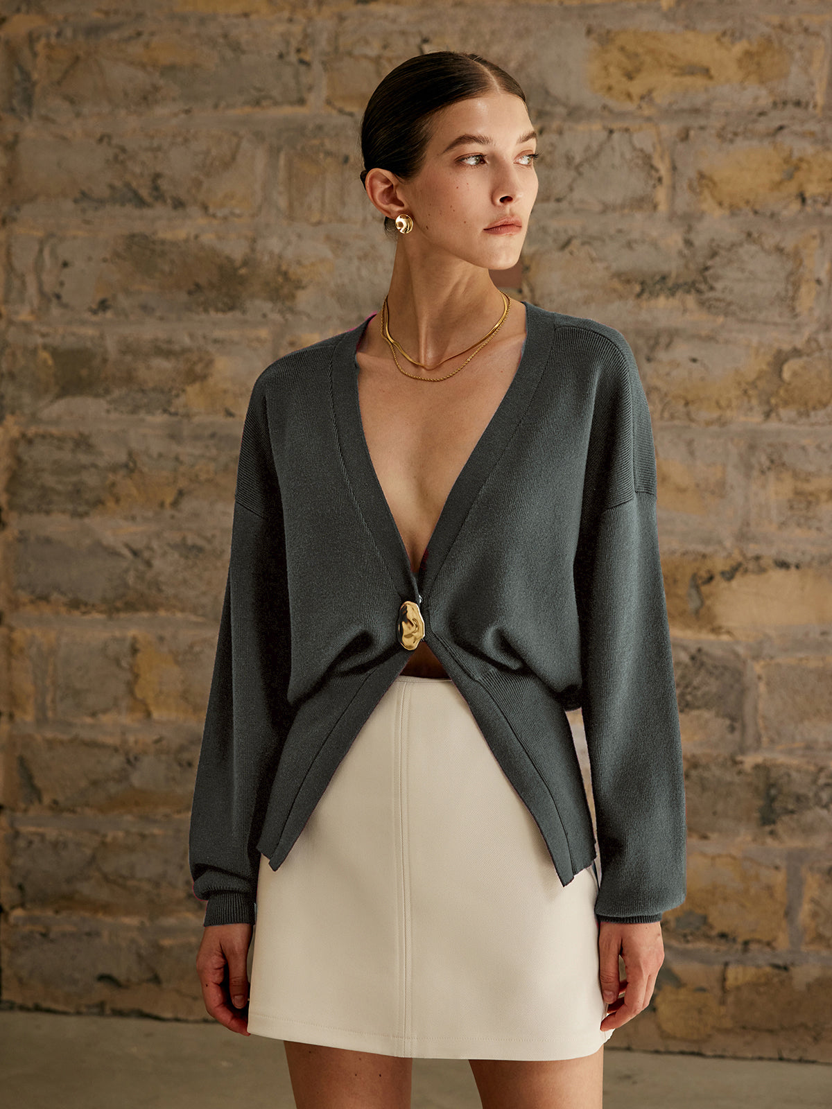 Women's deep V-neck cardigan with a single gold-tone button at the waist - slate grey