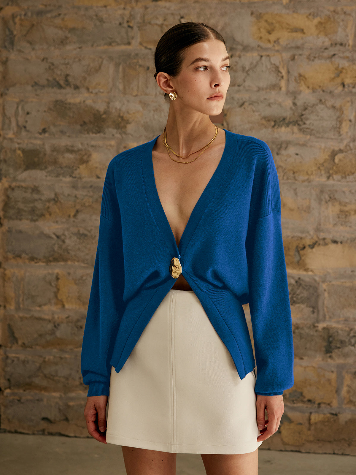 Women's deep V-neck cardigan with a single gold-tone button at the waist - cobalt blue