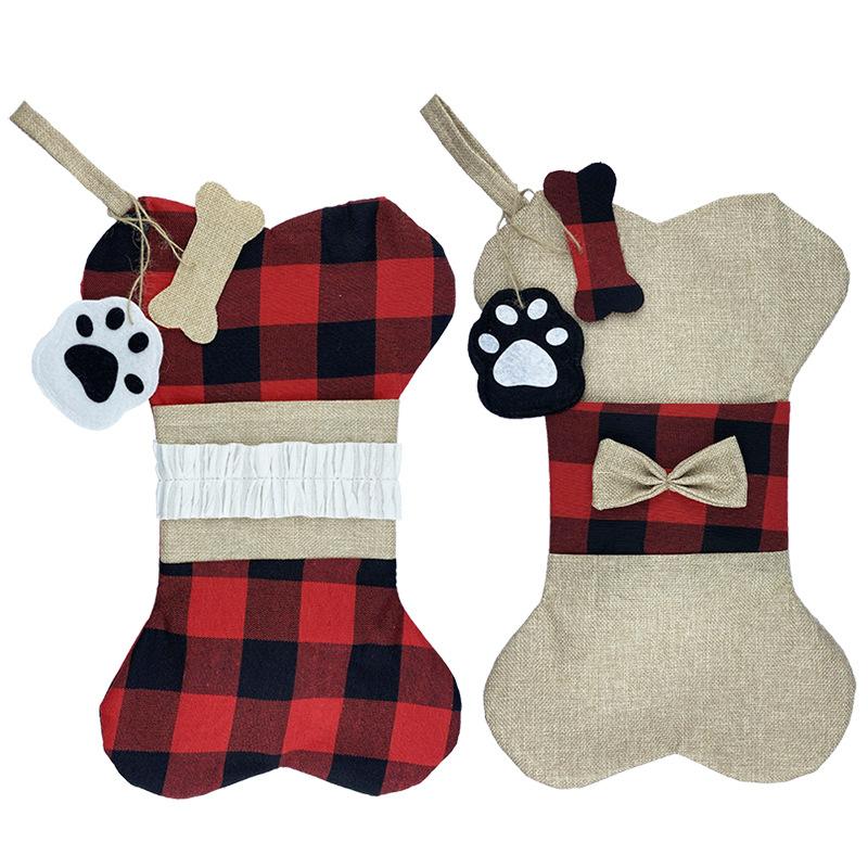 Bone-shaped Christmas stocking for a dog with a paw print tag and hanging loop