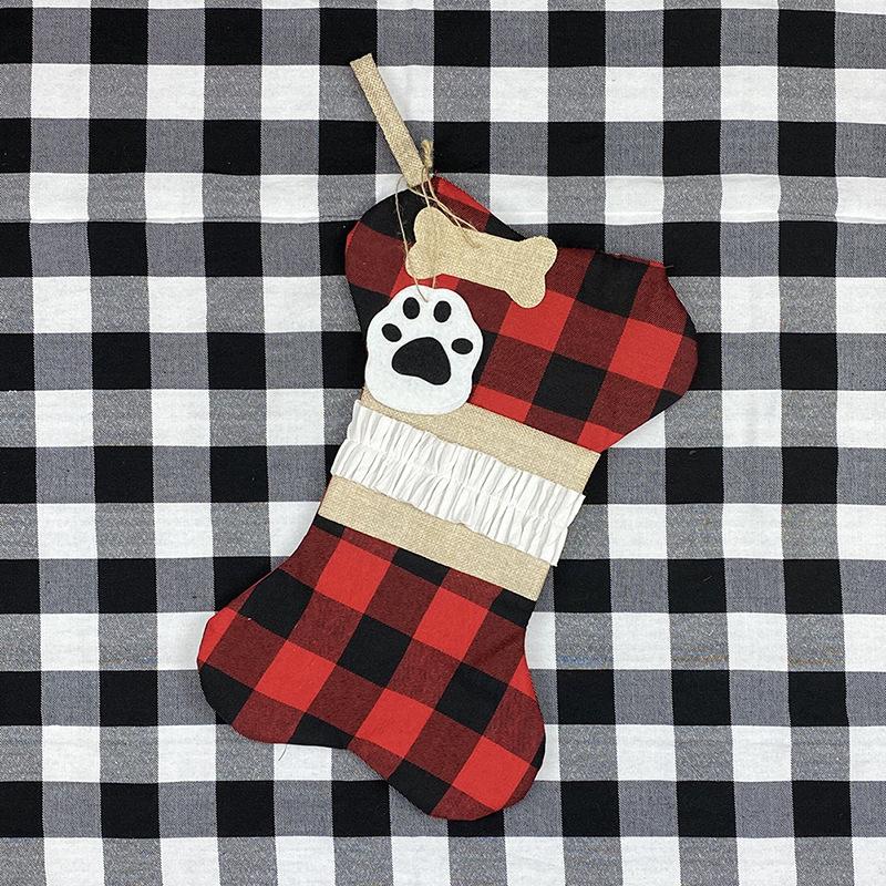 Bone-shaped Christmas stocking for a dog with a paw print tag and hanging loop - red and black check