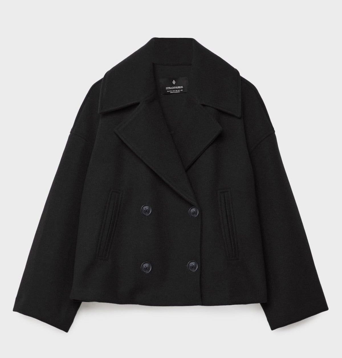 Short peacoat with a wide lapel and two rows of buttons