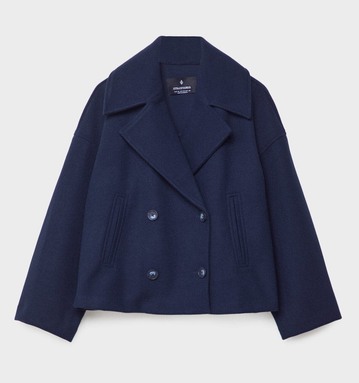 Short peacoat with a wide lapel and two rows of buttons