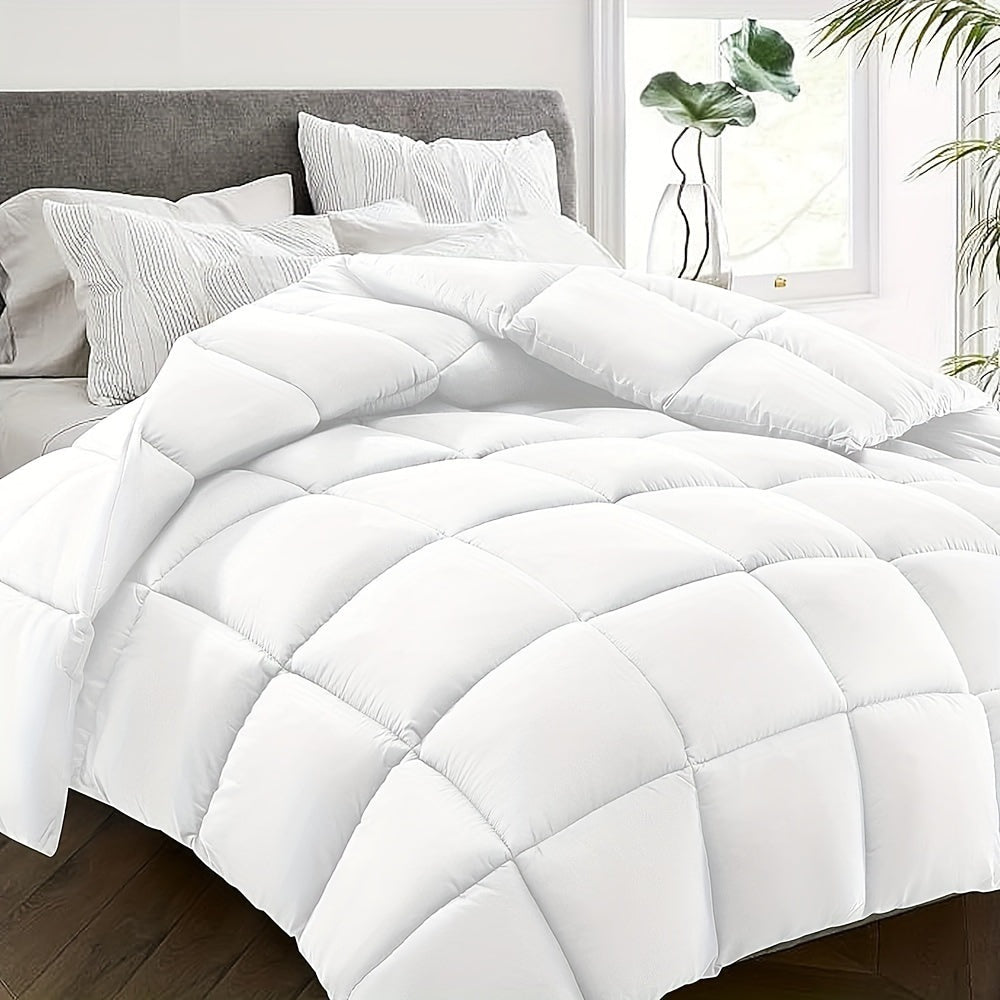 Quilted duvet without a cover on a made double bed - white