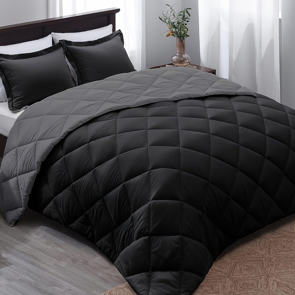 Quilted duvet without a cover on a made double bed - grey and black