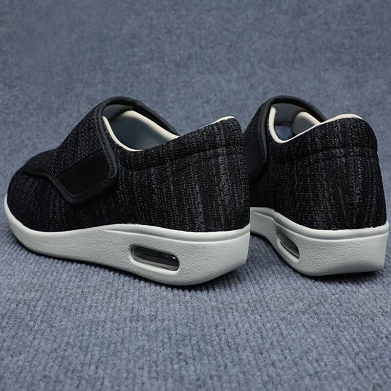 Ergonomic wide-fit shoes with an adjustable touch-fastening strap