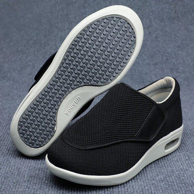 Ergonomic wide-fit shoes with an adjustable touch-fastening strap