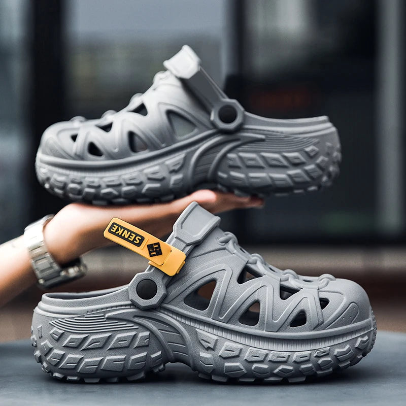 EVA clogs with large cut-outs, a pivoting heel strap and chunky tread sole - grey