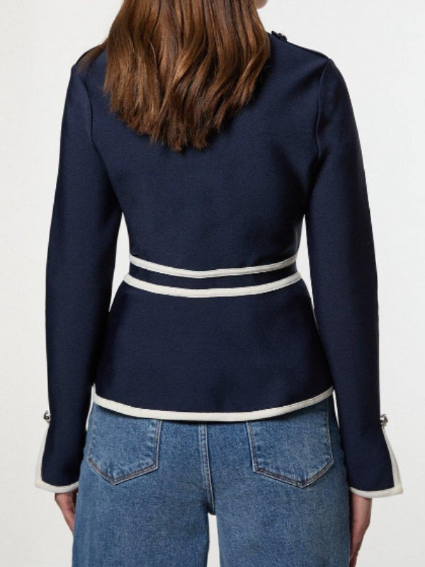 Navy jacket with cream contrast piping, a round neck and zip front