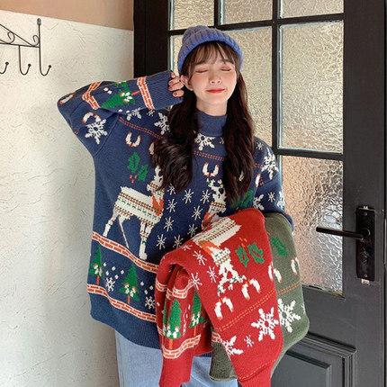 Women's knitted Christmas jumper with two Fair Isle reindeer, snowflakes and trees