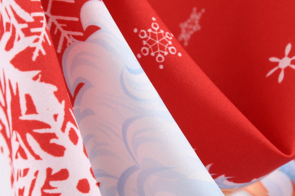 Women's Christmas swing dress with Father Christmas faces and a snowflake hem