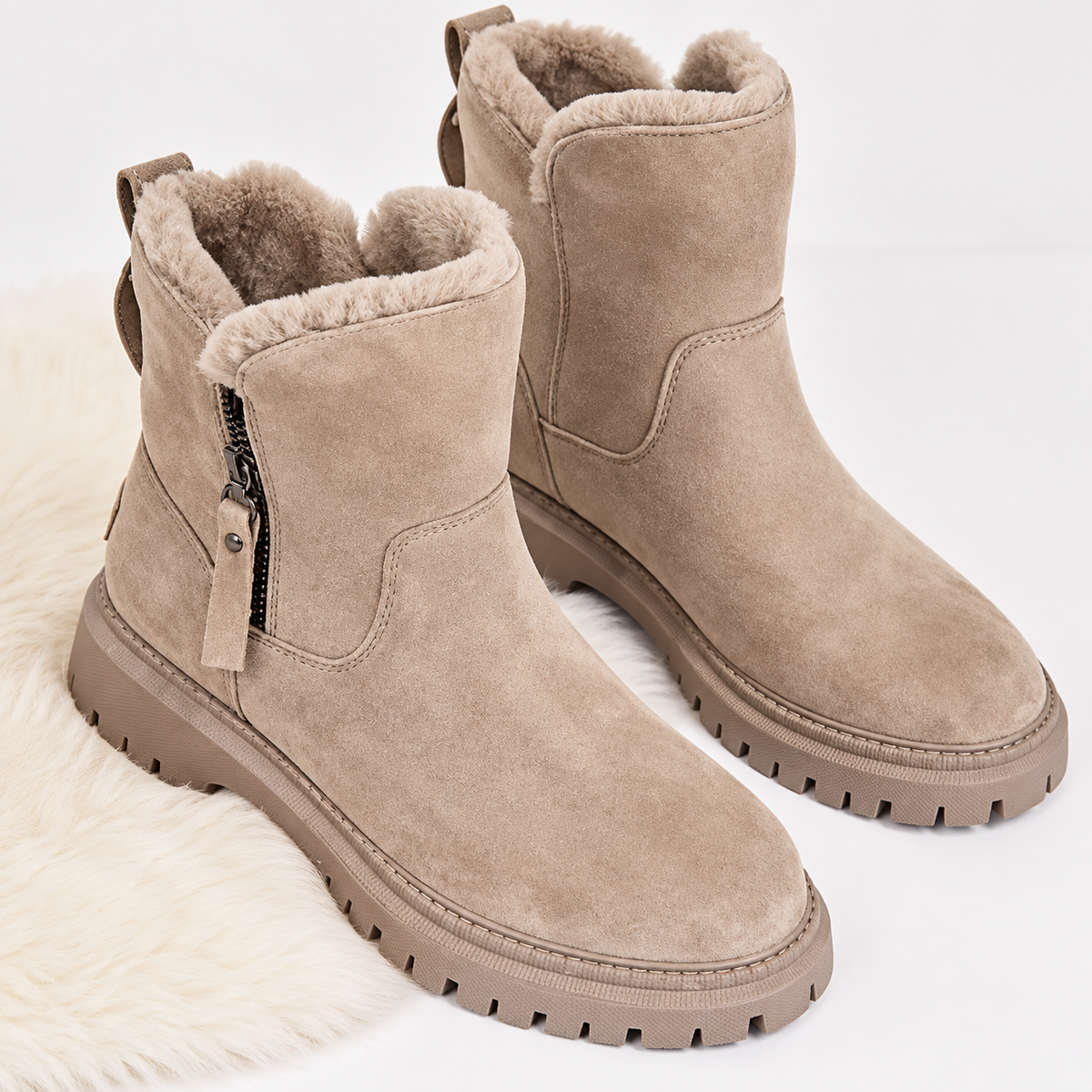 Women's suede-look ankle boots with a faux fur lining and side zip