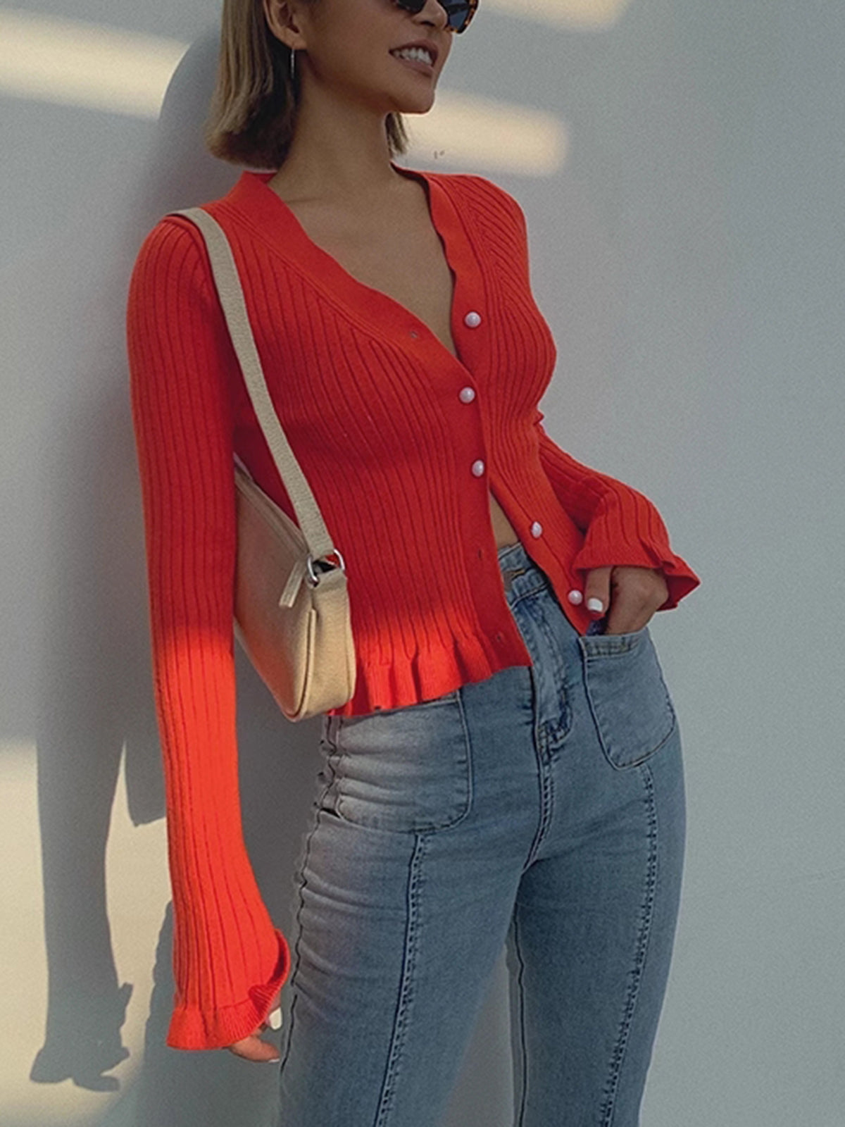 Women's fitted ribbed cardigan with a V-neck, pearl-look buttons and ruffle hem