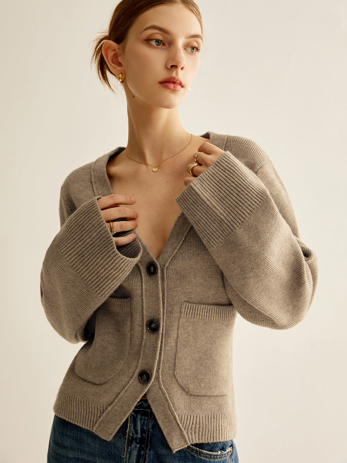 Women's fitted V-neck cardigan with flared sleeves and patch pockets