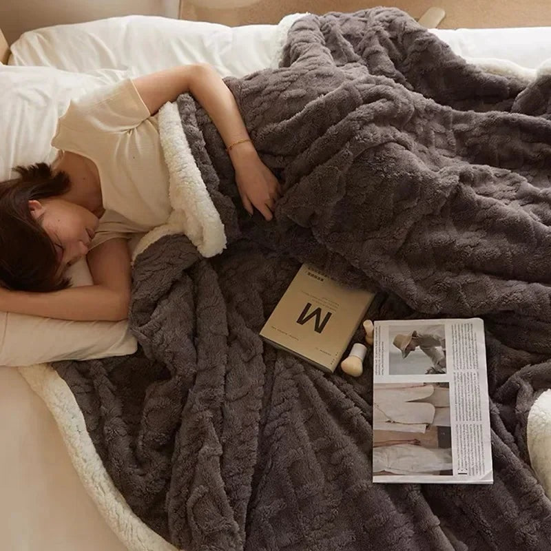Fleece blanket with a sherpa reverse and an embossed pattern on a double bed - charcoal