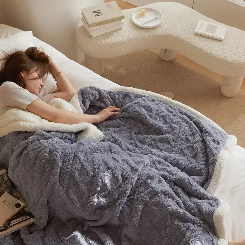 Fleece blanket with a sherpa reverse and an embossed pattern on a double bed - dusty blue