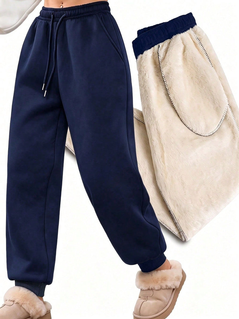 Fleece lined joggers for women with a teddy lining and drawstring - navy