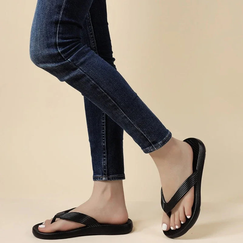 EVA flip flops with a thick sole, ribbed strap and a footbed with diagonal ridges - view 2