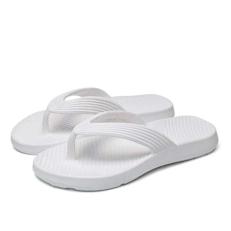 EVA flip flops with a thick sole, ribbed strap and a footbed with diagonal ridges - white