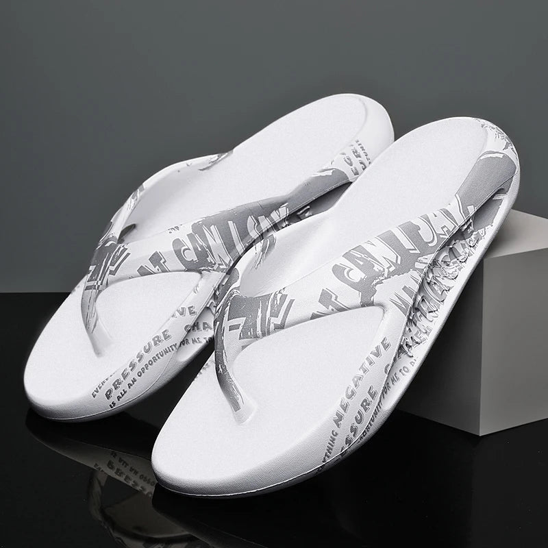 Flip flops in EVA with thick sole and letter print across straps and footbed - white