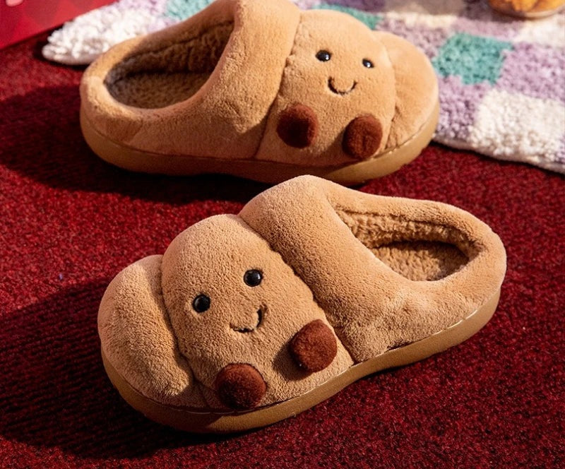 Fluffy slippers shaped like a croissant with stitched face, teddy lining and thick sole