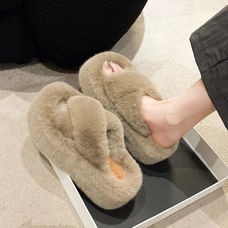 Slippers with crossed faux fur straps and a thick platform sole covered in plush - view 5
