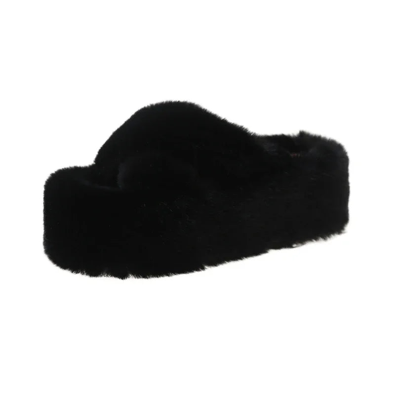 Slippers with crossed faux fur straps and a thick platform sole covered in plush - black