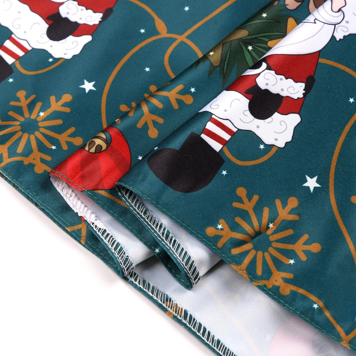 Girls' sleeveless Christmas dress with a bow and a festive print