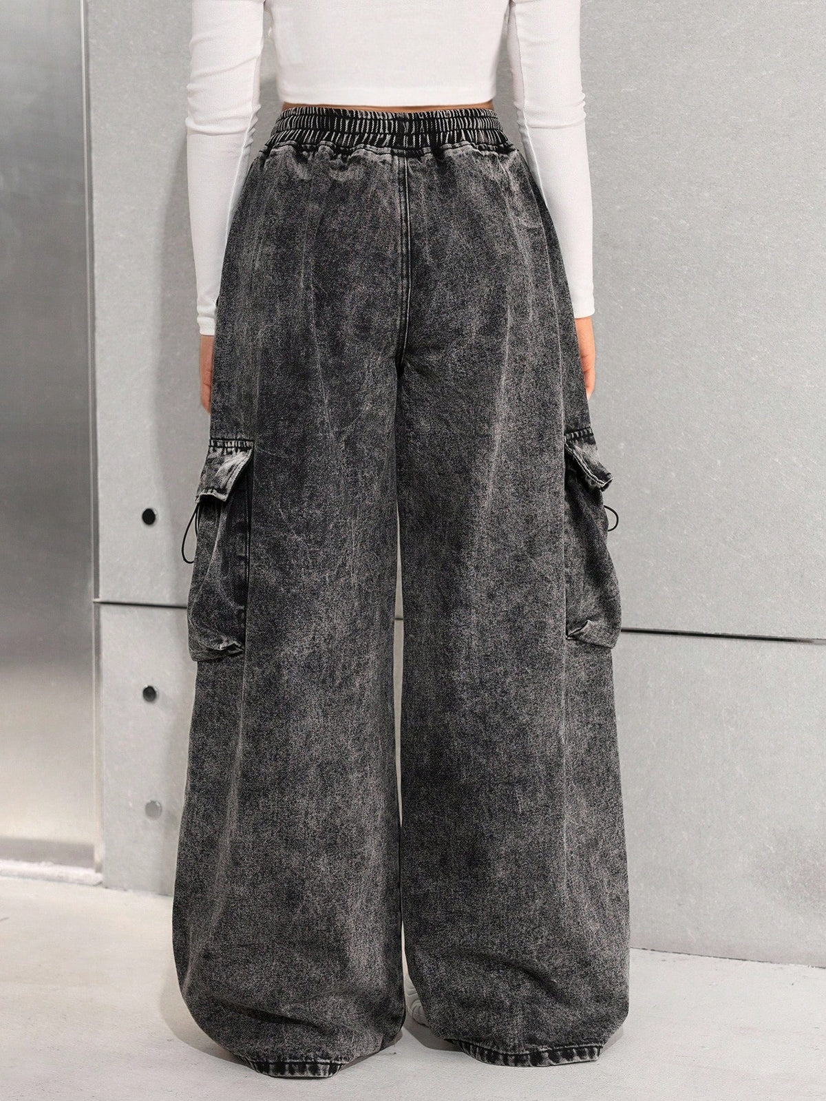 Wide leg cargo jeans for girls in stonewashed denim with drawstring waist and flap pockets - washed black