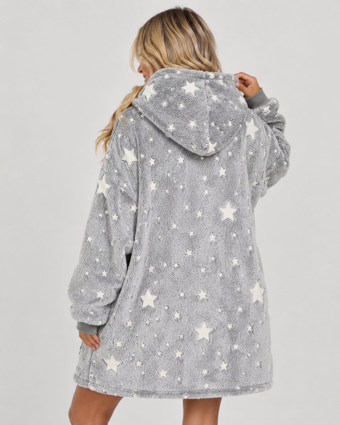 Grey oversized blanket hoodie covered in stars that glow in the dark