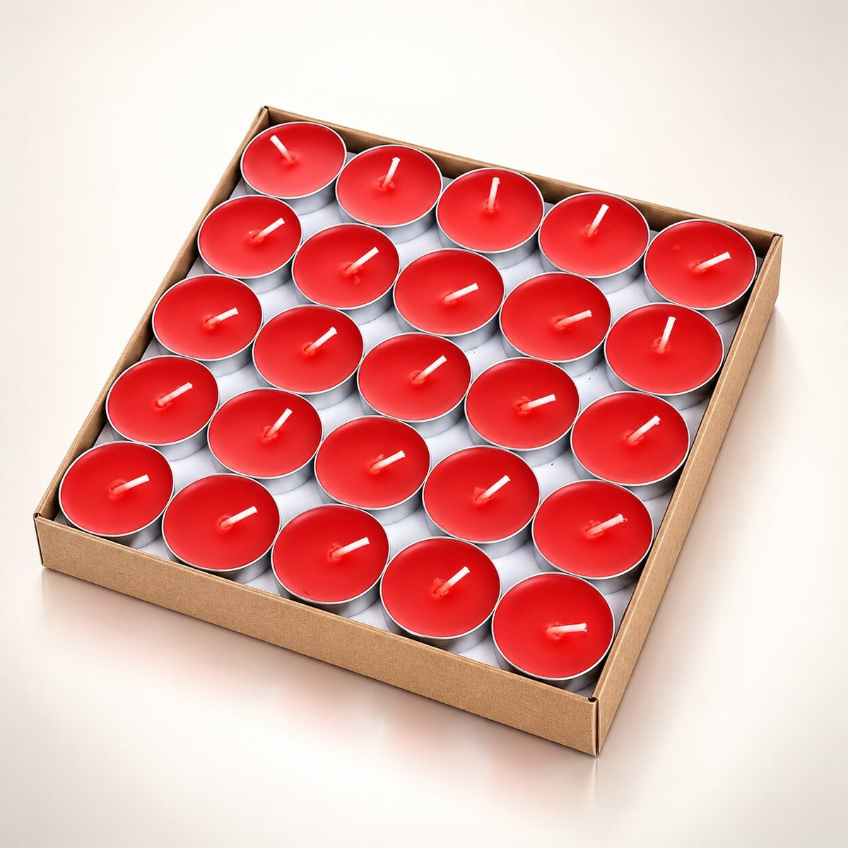 Coloured heart-shaped and round tea lights in cardboard boxes - red
