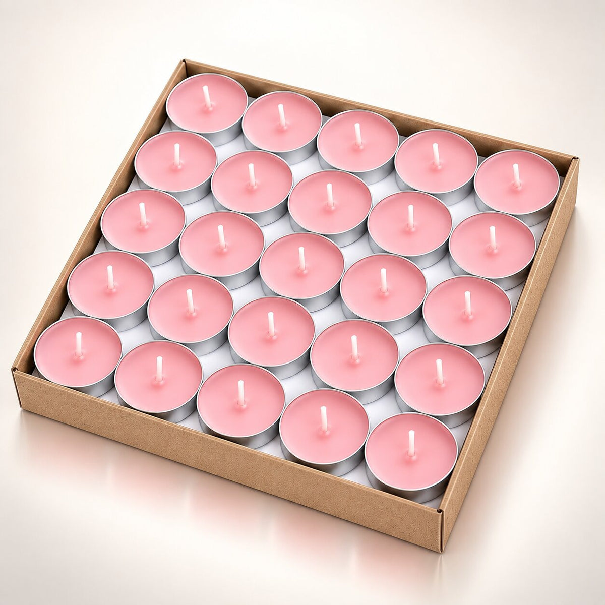 Coloured heart-shaped and round tea lights in cardboard boxes - pink