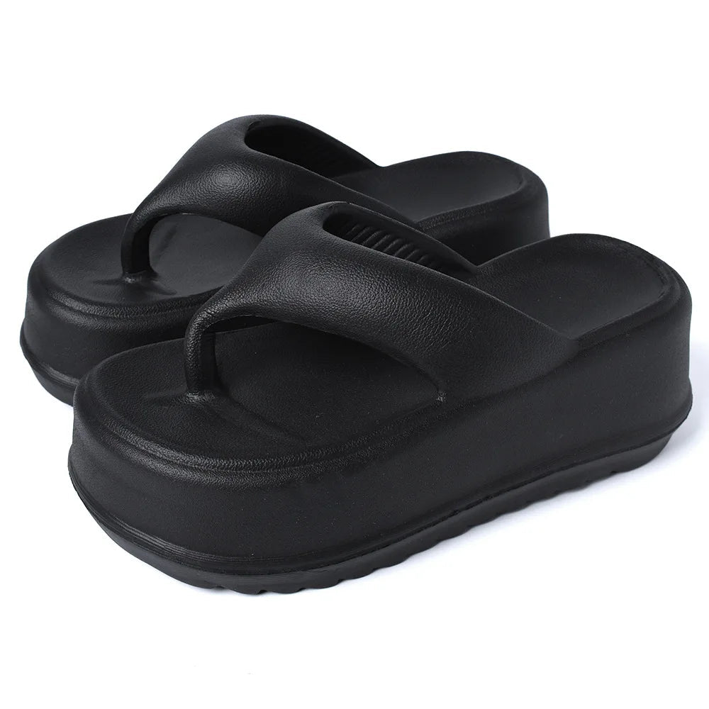 High platform flip flops in EVA with a thick toe-post strap - black