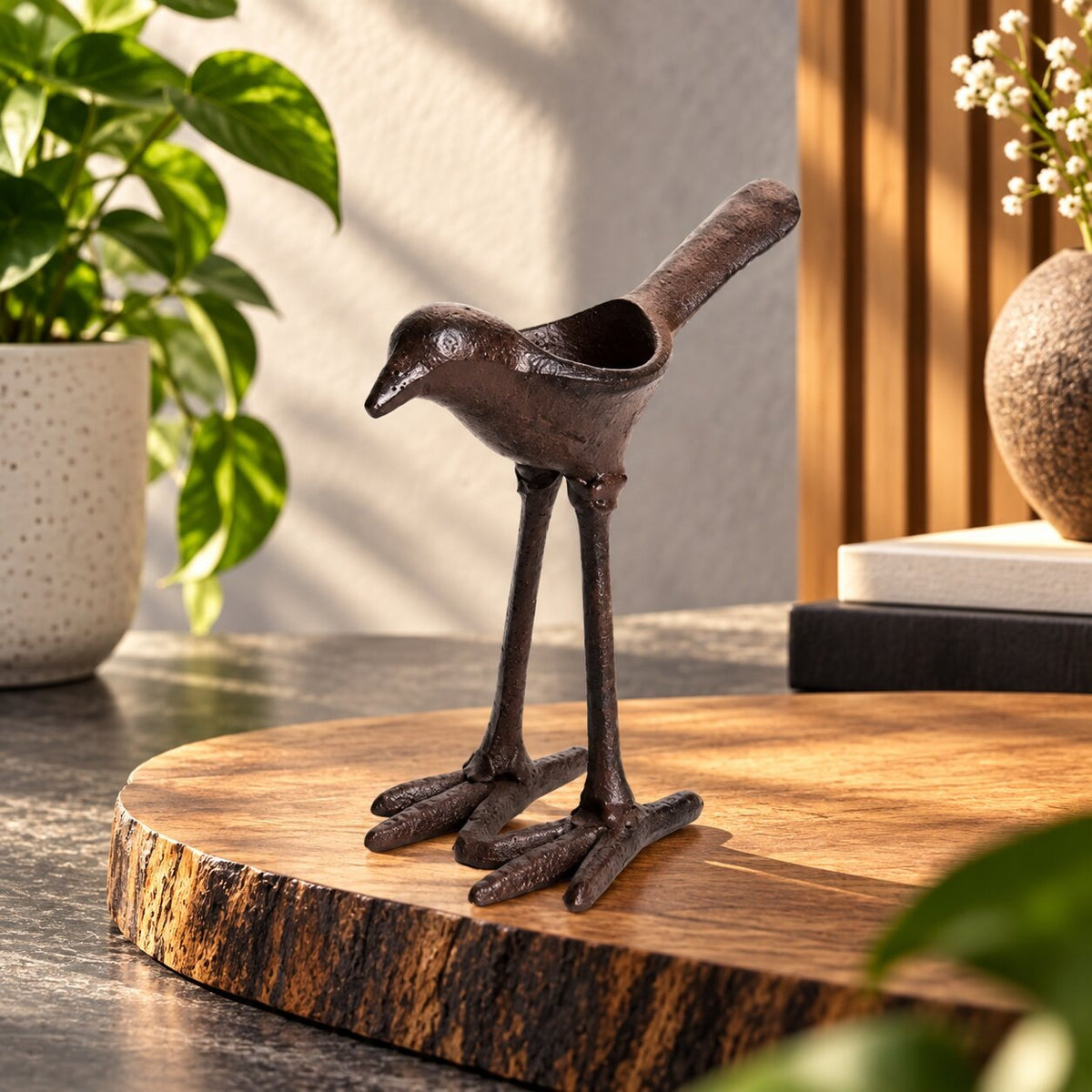 Dark iron tea light holder shaped like a bird with long legs - view 2