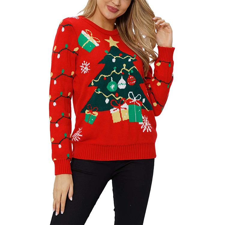 Women's red knitted Christmas jumper with a festive motif and fairy lights