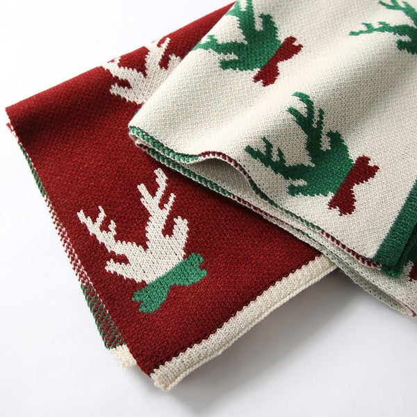 Knitted Christmas scarf with a knitted-in festive motif and ribbed ends