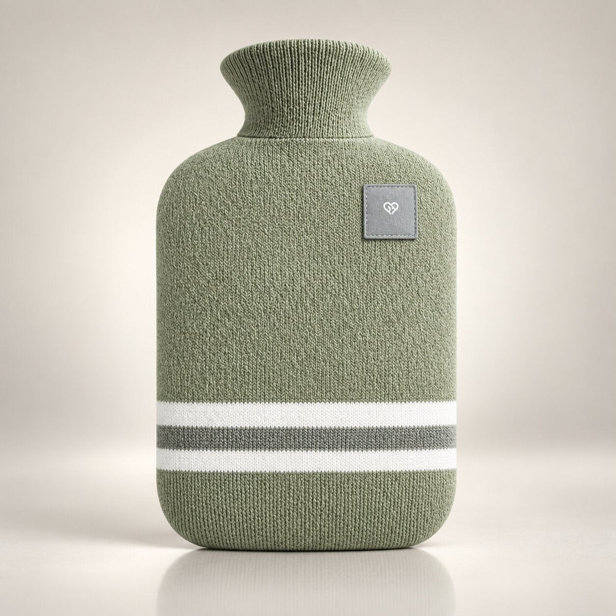Knitted hot water bottle with stripes and a folded collar - sage green