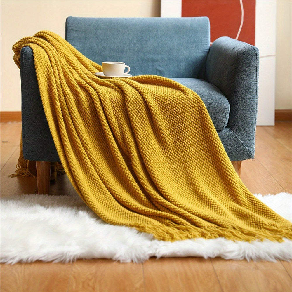 Knitted throw with a bobble texture and fringes - ochre