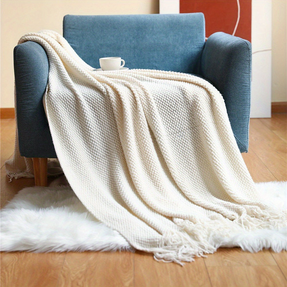 Knitted throw with a bobble texture and fringes - cream