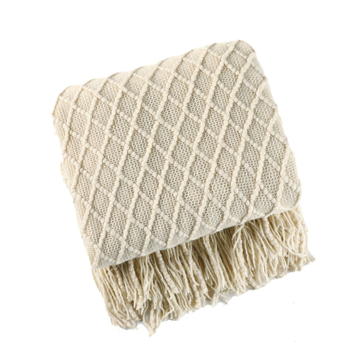 Knitted throw with a Scandinavian pattern and tassels over a chair - ecru