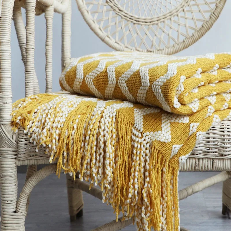 Knitted throw with a zigzag pattern and long tassels - mustard