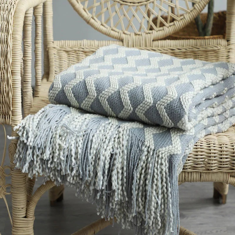 Knitted throw with a zigzag pattern and long tassels - light blue