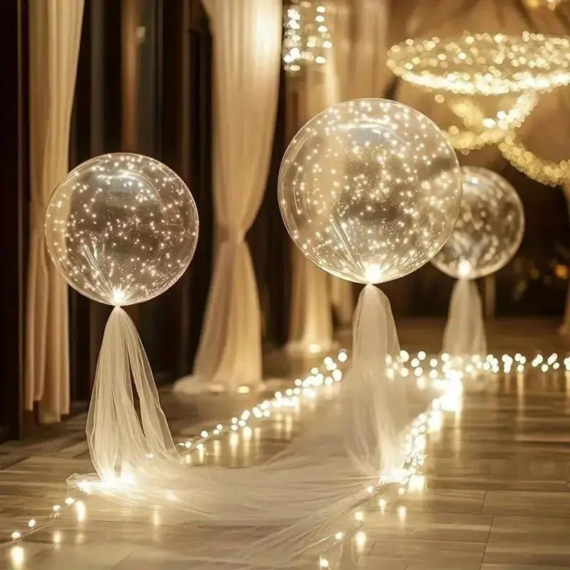 LED balloons with a light string in warm white along a garden path - view 3