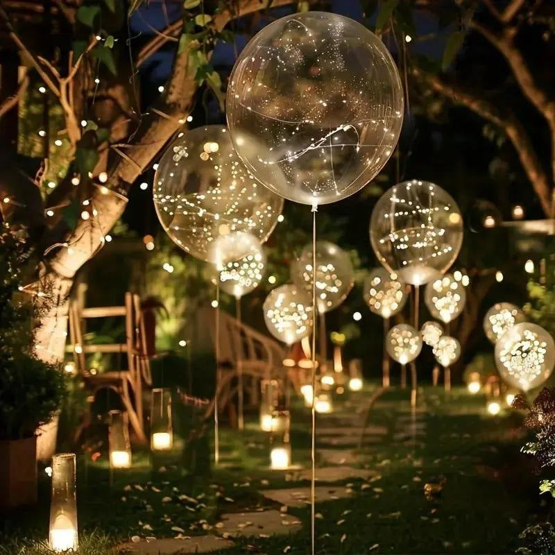 LED balloons with a light string in warm white along a garden path - view 7