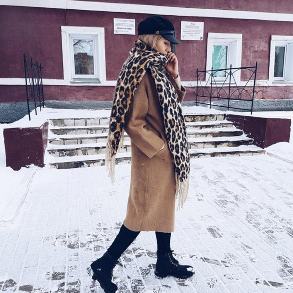Women's woven leopard print scarf with twisted fringe