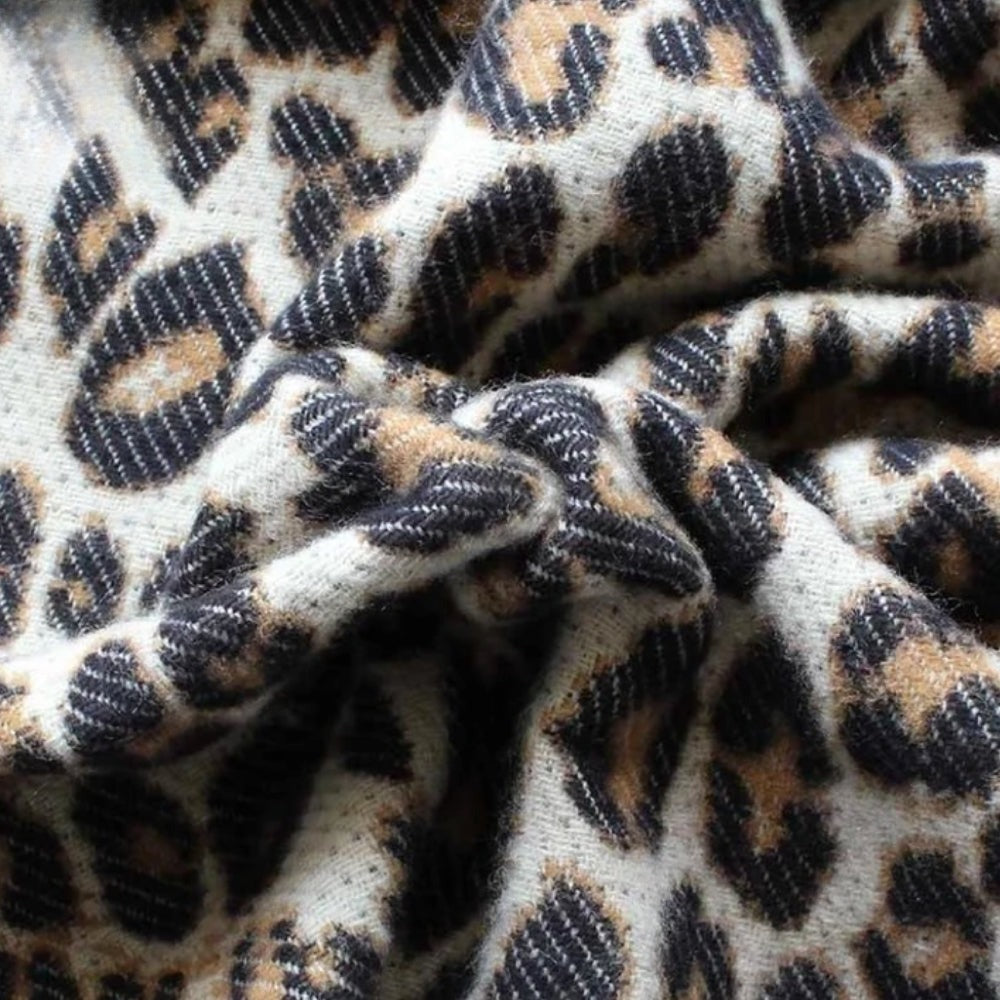 Women's woven leopard print scarf with twisted fringe