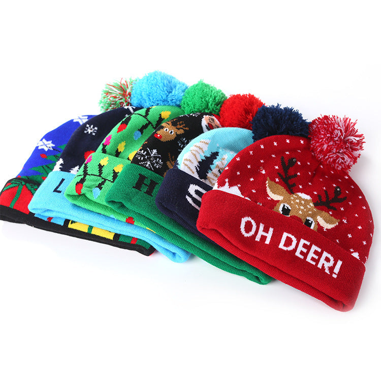 Knitted light-up Christmas beanie with a lettered turn-up and big pompom