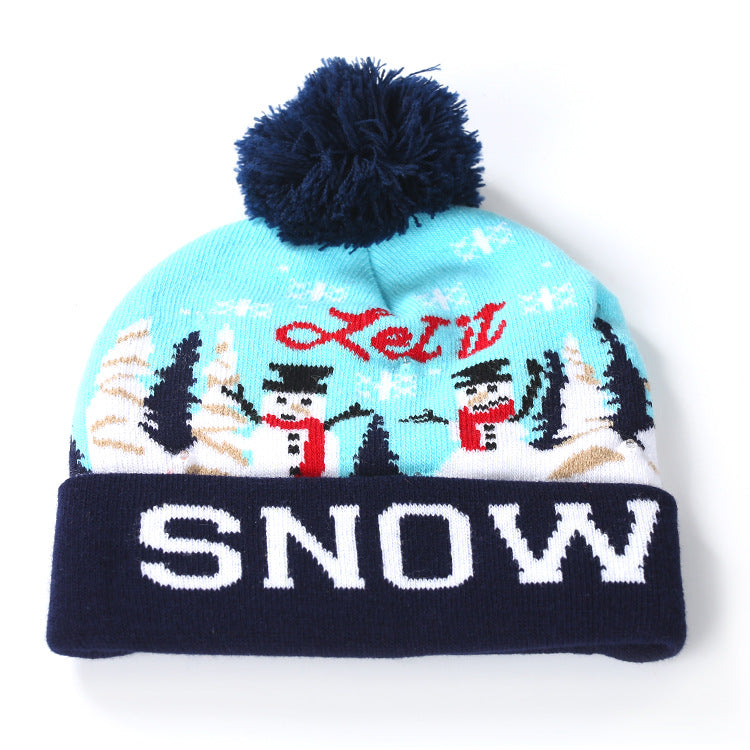Knitted light-up Christmas beanie with a lettered turn-up and big pompom - light blue snowmen