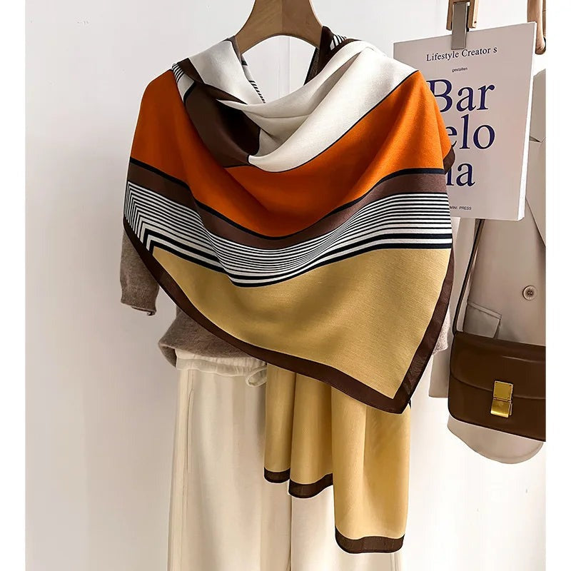 Women's lightweight scarf with a graphic print of blocks and stripes and a narrow contrast border - orange/ochre