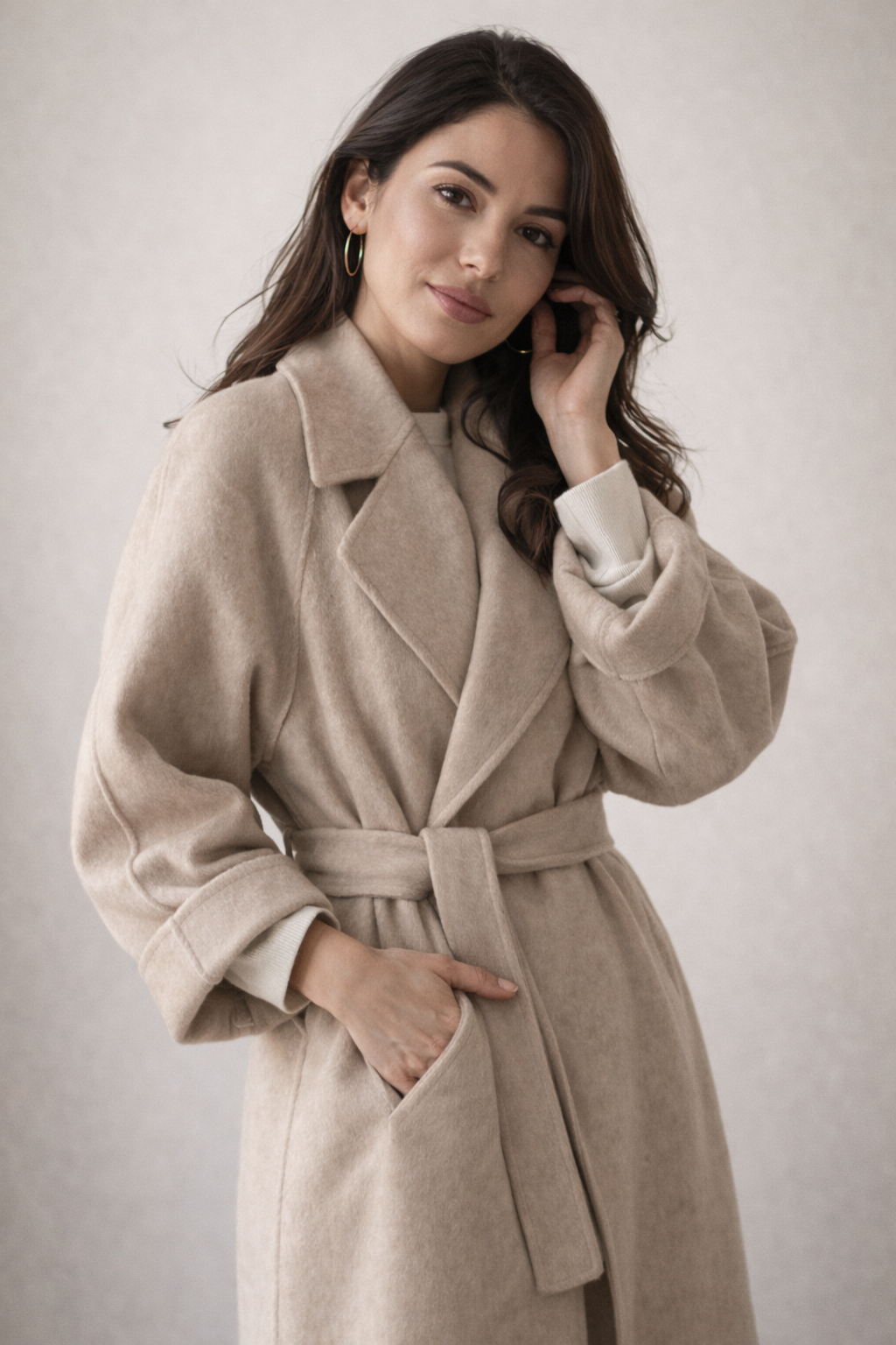 Women's long coat with a notch lapel and tie belt
