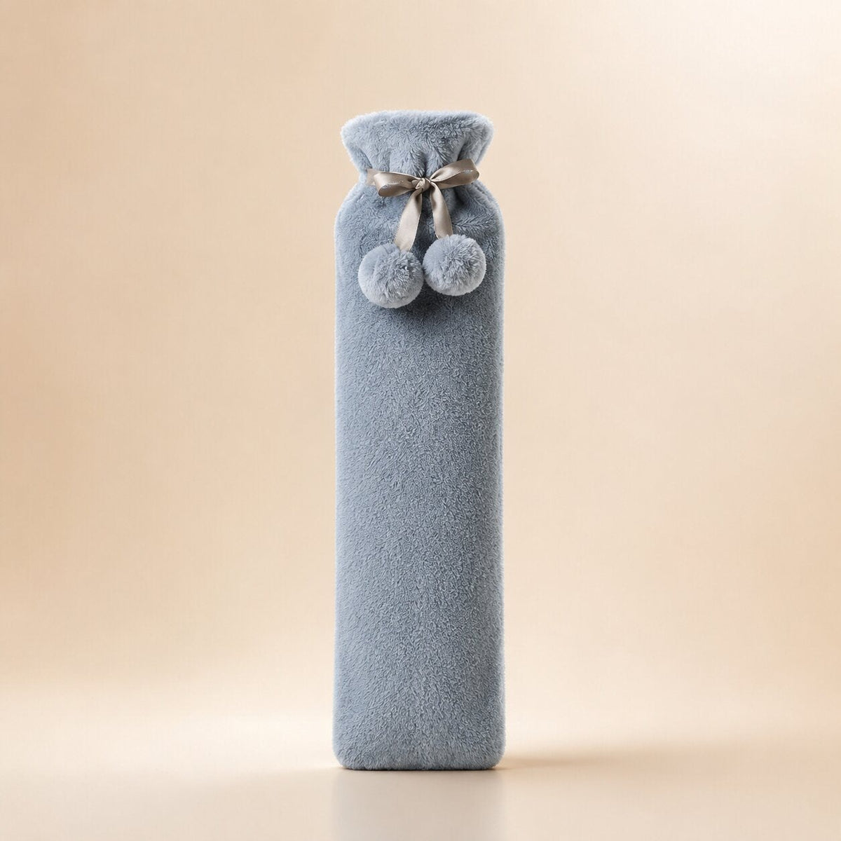 Long hot water bottle with a plush cover and pompoms, small or large - grey, small